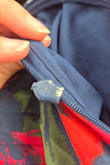 I love this dress but the zipper came with obvious damage and did not work. After several tries, one side came completely out of the zipper. It was clear there was already damage so I assume i got a garment someone had previously returned. This zipper is not slavageable. - Andrea R.