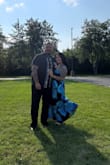 This dress is absolutely gorgeous, even more so in person. The big blue flowers are stunning. I wore it to my bonus son's wedding & I got so many compliments. I'd say it runs true to size, although it was a bit tighter in my breast area. I wore it strapless, and I had no issues with the top falling down at all. The dress is very well made and light. 
I did have to have it hemmed, as I am only 5'0 and the dress was super long. I am wearing 4inch heels with this dress, and it fit perfectly. Even after switching shoes to 2.5-3inch wedge sandals, the dress was still a perfect length after being hemmed. Overall, I am very happy with my purchase. - Norma R.
