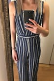 I don't even know what to say other than the stripes were so unbelievably crooked in the front that it looked ridiculous. I wouldn't leave the house in it. The photo doesn't do it justice at all. I know there are seams on the hips that would make those stripes not line up, but the stripe right up the middle looked so bad. I tried adjusting it every which way and nothing fixed it. I had also ordered up a size and it was still pretty small, but the length was way too long. Honestly, I'm just extremely disappointed all around. It would have been so cute if the sewing job weren't a total fail. - Skylar T.