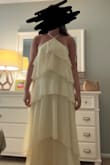 I'm really sad that this dress didn't work because it was absolutely beautiful. The color was stunning and I love the layers. However, I was surprised because I ordered a small and I am on the taller end at 5'8 and the dress was still very long, even with heels on. It fit perfectly in the waist area. However, if you have a bigger chest, this dress will not work for you. Had some side boob action popping out of the sides, and if you go to adjust it to make it tighter/higher up it cuts off the circulation on your neck. - Madison S.