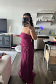 Ordered this dress for a black tie wedding. It fit me but the material on the dress was really weird. There was extra fabric in the ruching hanging over my hip, which was not pictured. Going to return it due to this. The way it laid made it look not black tie at all. I'm 5'6 and the dress was extremely long. - Emma B.