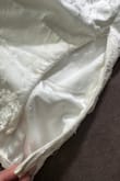 Bought this dress for my bridal shower and was super excited to wear it. I tried it on days before; everything was perfect. As I was getting ready to leave from my bridal shower and putting the dress on, the zipper came undone. My sister was able to reconnect but shortly after it popped open again. My sister had to hand-sew me into my dress, and I was an hour late. To say I was upset was an understatement. - Sydney G.