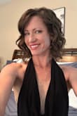 I love this dress! It is probably the sexiest thing I own, but I still felt very classy at an event with my lawyer boyfriend. It is very snug, but I wouldn't want a bigger size. It clung in all the right areas & the neckline draped beautifully. The fabric itself is stretchy, but the waistband doesn't give much. I had to wiggle to get it over my hips without popping a thread. I paired it with a long lariat necklace. I received so many compliments that night. - Cynthia C.