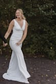 I have worn this dress for multiple wedding photoshoots and I must say I LOVE it! Good quality, and fits how it should. Long enough for 5'8 with about 2.5 inch heels. - Ashley H.