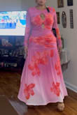 This is my second time ordering dresses from this site, and just like the first time, the dresses were gorgeous, exactly like in the photos. I ordered this one in a size L, though I think a size M would have worked too; however, I kept the L because it fits beautifully. I thought the colors and material were lovely and unique compared to standard dresses. - Lina M.