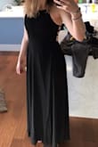 I bought this dress in a medium originally, had to do an exchange for the small because the chest was too big. I think if the back wasn't open and adjustable it would have been too snug, but the fact that it can adjust with the strappy back, you can definitely get away with sizing down. The waist band is elastic, so its forgiving. I found the medium was gape-y in the chest, so if you are small chested I would suggest sizing down! If you are any bigger than a B or small C, you'd need a medium.
I normally wear a size 4-6 jean.
I am 5'8 and wont have to get it hemmed, so if you are taller keep that in mind... - Brenna H.