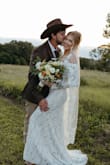 This dress was perfect for our backyard wedding in our field. It fit perfectly straight out of the box, and I love that it came with a bag to store it in. It is a little tight around the shoulders, which is a good thing to keep it up(you don't have to worry about it slipping down at all!), but don't expect to be able to raise your arms very high. I got so many compliments! - Heather K.