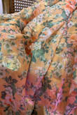 The material was even prettier than pictures. The gold sheen make this a great dress for a garden wedding event. I'm only returning it because the bodice is far too right. I ordered a size 6, I fit a 34D bra, recommend anyone with a C or D bust to go up to an 8. - Lisa D.