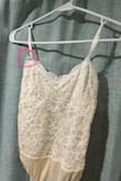 I purchased this to wear as one of my engagement photo shoot outfits. The lace is soft and pretty. Would benefit from extra lining in the bust area, as my pasties were somehow visible through the shirt, and the stitching on the underbust will hit at an odd place if you have a larger chest and wear a bra, as I did. It looked better without a bra, but I would have needed different pasties. The straps are very thin and flimsy. I wore this for less than an hour, and the strap on one side already detached halfway from where it's sewn. I have high profile implants AND wore a bra, so the straps were not doing any heavy lifting. If you look closely at the picture I attached, you can actually see the strap is already separating from the lace even while I was wearing it during my shoot. I won't be able to wear this again unless I sew the strap because it's obvious the lace is separating from the strap when wearing, and it will definitely unravel the rest of the way if I wear it again. Really disappointing. - Annika S.