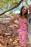 This dress is comfortable stretchy and true to size. The colors are vibrant and true to the pictures on the website. I wore it to a beach wedding, and it was appropriate for the occasion. I don't love this particular style on myself; I decided after wearing it, but the dress itself is nice and feels like decent quality for what it is. - Annika S.