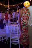 Loved this dress! The print is even prettier in person, and the fit is really flattering. I originally bought a Medium, and it definitely hugged all the right places, but once I sat down, it was a little too tight and gave me that "sausage" feeling. I ended up purchasing the Large, which gave me a slightly looser, more comfortable fit while still looking flattering. I'm also not very busty, so the halter was a little long on me. I twisted the straps around twice before tying it, and that did the trick; it still looked great and stayed in place. Wore it to a wedding in Mexico and it was comfortable, colorful, and perfect for the occasion. Hope this helps anyone between sizes! I'm usually between a 6 and 8 in bottoms with a little wider hips. - Marisol G.