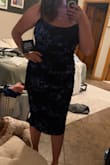 If you're looking for comfort go with this dress! I loved it and my sister is six months pregnant and she will be wearing. It looks great with a bump! - Emily M.