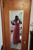 This dress is so pretty. No stretch, though, and it fits like a glove. Silky material, so you may want to have shapewear underneath because every bump will show. - Pauline D.