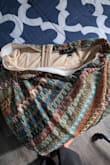 I wasn't expecting the skirt to be shiny. The photos don't clearly show the silver thread running through the fabric. It's also slightly thicker than anticipated, likely due to the inner lining. My main issue, however, is the waistband: it isn't stitched down properly, so it keeps folding over while I walk, making it very uncomfortable. - Shal T.