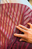 I would have given 5 stars but was worried that the mesh part will run or tear further. It already has holes all throughout. It's like when they were working with the fabric, they put a tag through it or something. The holes were regularly spaced all throughout but weren't part of a design/intentional. I ordered a small and medium (def didn't need the medium), and it was in both dresses. If you're between sizes, size down. Lots of stretch - Morgan H.