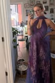 The neck is super tight, and the bust is tight in weird areas, but the rest of the dress is loose. I feel like it would look amazing on someone petite with a flat chest. - Jaden J.