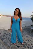 Love this jumpsuit. Beautiful vibrant blue color. Bought it in a medium.  Fits like a glove. - Jodi N.