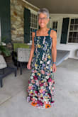 I absolutely love this dress! It fits well and is very flattering. I'm 5'6" and will wear 2-inch heels, so I'll have to have it shortened a bit. I'm only disappointed that I may lose some of the flowers at the bottom. - Lela R.