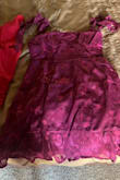 The dress fits great. However, I bought it thinking it was a bright pink, but it's more of a purple. - Brittany R.
