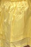 The color is NOT what I expected from the photos. Online it looks pale, creamy yellow, but in person it's brighter and more lemony yellow. Recommend to SIZE UP! I ordered Large and it runs noticeably small around the bust, fitted because of the zipper. Too bad it's final sale. - Su K.