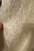 Fabric has a floral pattern and is completely different from the listing photos. The top is very loose, but the zipper won't zip past the seam around the bust and is too tight. - Karyn C.