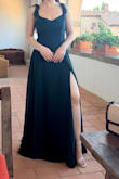 The dress was well-made, with an elegant touch. The buttons in the back, give it character while the zipper is hidden underneath them. The neck line in the front allows for any jewelry aesthetic you choose to elevate your outfit. - Haley E.