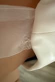 I received this dress a few days before my wedding, and it arrived with a tie strap torn, and the other one looks like it would be easily broken. I'm very disappointed since there's no way I will get a replacement on time! Generally, it looks pretty on me, but the tie straps are made cheaply. - Rachel B.