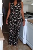 I was a little hesitant to purchase this because jumpsuits can go really wrong really quickly. As a girl with a larger bust it can be difficult to find a jumpsuit that leaves room for my "girls". This fits really nicely and covers them up and actually allows me to look classy and elegant which rarely happens with my body type these days. I could probably fit a medium as well, but the large will definitely allow air to flow through to my thighs which is a must for Summer clothing in humid areas. Also you will need to wear some sort of heel if you are my height, otherwise it will drag around on the floor. I love this jumpsuit! - Justina W.