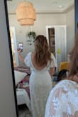 This dress is beautiful, unique, classy & sexy! It was perfect for me on my wedding day. Like other reviews say, the top is very large and the sleeves just fall off. I got it altered. With all the beading, alterations cost almost as much as the dress did. And unfortunately, this dress is very fragile and it constantly sheds and loses beads and has little strings sticking out everywhere. Once you wear it, it can probably never be worn again because it loses so much of the beading. There are definitely downsides to this dress even though it is beautiful. I have no regrets though! - Courtney P.