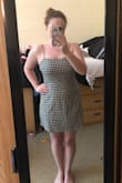 I have been wanting a dress like this one for a while, so i decided to splurge and purchase one. First of all, it shipped very quickly. I purchased it on a Saturday and received it Wednesday morning. I tried it on today, and I really like it. This is my first purchase from LuLu's, so I wasn't totally sure which size I should get. I read the other reviews and decided to go up a size. I am a 6/8 and can pretty much always count on a medium to fit. I went with a large in this dress. I'm glad that I sized up because otherwise it would have been skin tight on my thighs. It has adjustable straps which is great, and the ties in the back help ensure the perfect sizing for you as well. It's pretty thin, but you can still get away with not wearing a bra. I wear sticky boobs under mine. I find it can look a little awkward if I'm slouching at all (pictured on the right), but when I'm upright it looks great. I'm excited for more LuLu's purchases in the future! - Martha U.