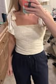 It's always hard to find a cute white top but this one is adorable! I love the little bows on the shoulders you can tie. - Jessica S.