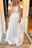This dress is beautiful! I'm always worried white will be see through, but this material is very good quality and photographs perfectly! We are using it for my daughter's engagement photos and obviously need to steam it, but you get the idea! LOVE, LOVE, LOVE IT! - Emily E.