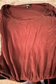 Wanted to love this top, but after only one wash, the material changed. It now feels thin and attracts lint within the wash, even washing it with alike colors. - Rachelle P.