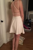This dress is perfect for my bachelorette party. It's classy, but sexy at the same time. There is a tight layer underneath that is good because if you are spinning around dancing, it won't come up. The material is sturdy and not see through at all. No need to wear a bra! - Carly A.