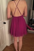 I like this dress a lot, but the fit was a little strange for me. I found it a little loose in the chest, so I had to tighten the straps a lot, which made the back ride up slightly. Other than that, I love it. The color is gorgeous and really different. It's not too short either and I was worried about that. - Carly A.