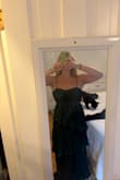 Very flattering! Might just be me, but it's looser towards the bottom and tighter up top. True to size mostly. A bit long. I'm 5'7 and need to wear 2.5-3 inch heels to achieve floor length where it isn't fully dragging along the floor. Otherwise, I would need to have it shortened. - Emily O.