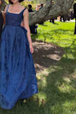 BEAUTIFUL DRESS! Got compliments all night. Has big pockets. So elegant. Bow stayed tied all night through lots of dancing. Adjustable straps! So comfy. Can't wait to wear it again. I normally wear a size 8 or 10. I ordered a large and it was far too big in the torso. I have a short torso but bigger bust so I thought it might be ok, but it was unwearable. Exchanged for a medium; the top fit great, but the waist was too small. I couldn't zip it the last half inch. I wore it anyway and just folded the unzipped section under and it still looked ok. It's a long dress which is great for tall girls like me (5'9 and wore 3 inch heels) but it may be too long if you are short. - Sam Y.