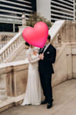 I wore this dress for elopement photos at a courthouse. It fits true to size. I did want mine on the tighter side, so I got an XS, but I could have gone with the S, as the lace sleeves are pretty snug! I didn't experience it being see-through at all. Not a ton of bust support for larger chests, but still comfortable. I used a steamer to smooth the wrinkles, and it looked beautiful! I loved this dress so much. It's the perfect blend between classy and sexy! Lots of compliments, and it felt high quality. I can confidently recommend this gorgeous dress! - Chelsea G.