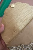 I bought this clutch for a wedding and was extremely disappointed in the quality for the price. It feels like the fabric was glued together, and you can even see some glue marks on the front. It was even damaged on the inside, with pucker marks in the fabric. Lulus has always had good products, but my last few purchases (especially this one) have fallen short. - Carly V.
