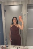 How to size down from a medium to a small, it has a very nice flow to it, and the open back was very nice. Even after sizing down to a small, it was a tad big on the chest; however, fit great when I added an adhesive bra. - Angela A.
