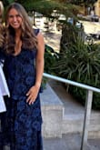 This dress was gorgeous and comfortable. The deep cut was paired nicely with the ruffled lace. Worn for a ceremony for graduate school! - Marie M.