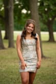 This dress is gorgeous. My daughter wore it for homecoming. It was different than everyone else's dress, which all looked the same! It was classy and timeless! It is smaller in the hip area, so we went with a large and had the top altered. The medium fit, it was just snug in the butt. - Vanessa M.