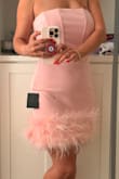 This dress is very cute. The material is a little stretchy. I wore it for my friend's wedding and it was nice on me. - Mar R.