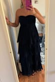 Fits great and is a good length with heels. Zips easily and is not too tight or too loose. - Brooke S.