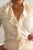 This blouse is absolutely cute! It's elegant, modern, and so comfortable to wear. Highly recommend it. - Elizabeth M.