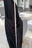 The zipper doesn't work right. Tried it on only a few times. Got frustrated and now returning. The zipper has no damage. IT WILL NOT ZIPPER WHERE THE 2 DIFFERENT MATERIALS MEET IN THE BACK. - Chelsea D.