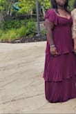I ordered this online without trying it on. I had gone to the store near me and tried on dresses in two different sizes; it seems like the size I got fit the best. I wore this for my brother's wedding as a guest. I was dancing, naturally, but the dress sleeves kept slipping. I tied the back tight, but to no avail. I also have a larger chest (DD), and the tits were OUT. This may have also been why the sleeves were slipping. While trying to pull up the dress, I ripped the side. I'm on the short side, about 5'4 or 5'5, and I had about 2-inch heels on, and the dress was still very much on the floor, but manageable to walk in and dance in, kinda. The dress itself is STUNNING and got many compliments. I don't think I personally would buy in THIS STYLE again just because of how it fit my body. - Purity N.
