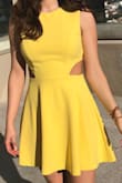 I ordered this expecting a rich, golden yellow color but it was more of a very bright fluorescent hue which didn't look good on my skin color.

The fabric is nice, thick and heavy. The cut/fit of the dress isn't very forgiving, if you have little rolls they'll definitely show. It's a pretty dress, though. - Tania M.