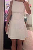I absolutely love this dress. I bought it in white for my graduation, and it is perfect, in the sense that it is modest but so simple and can be dressed up. I'm 5'7 and it's a perfect length. The material also feels like great quality. The only thing I will say is that the website recommended I get a size small, and I decided to size up to a medium because I've had dresses from here run small in the past, and I'm so glad I did because the medium is perfect! - Marissa C.