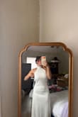 I ordered the XS and the chest area was a little big. I'm bigger chested and smaller in the waist. I think I could have gotten away with an XXS. Everything else fit perfectly. It has thick heavy material, but not too heavy and not see-through. A quick alteration and this dress is perfect. - Emma F.